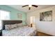 Charming bedroom with a comfortable bed, soft colors, and adjacent bathroom access at 6041 Broad Oak Dr, Davenport, FL 33837