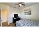 Well-lit bedroom with a comfortable bed, ceiling fan, and modern decor providing a relaxing ambiance at 6041 Broad Oak Dr, Davenport, FL 33837