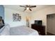 Comfortable bedroom featuring a ceiling fan, en-suite bathroom, and ample closet space at 6041 Broad Oak Dr, Davenport, FL 33837