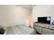 Cozy bedroom featuring a comfortable bed, dresser, and a serene ambiance for restful nights at 6041 Broad Oak Dr, Davenport, FL 33837