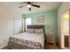 Cozy bedroom showcasing a queen-sized bed, complemented by a stylish nightstand and ample closet space at 6041 Broad Oak Dr, Davenport, FL 33837