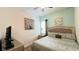 Comfortable bedroom featuring a plush bed, decorative artwork, and a calming color scheme at 6041 Broad Oak Dr, Davenport, FL 33837