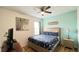 Comfortable bedroom with a queen bed, ceiling fan, and stylish decor creating a welcoming space at 6041 Broad Oak Dr, Davenport, FL 33837