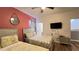 This bedroom features two queen beds, a flat-screen television and light-colored walls at 6041 Broad Oak Dr, Davenport, FL 33837