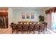 Inviting dining room featuring a large wooden table set for a meal and an abundance of seating for guests at 6041 Broad Oak Dr, Davenport, FL 33837