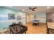 This large game room includes a pool table, foosball table, comfortable seating and blue accent walls at 6041 Broad Oak Dr, Davenport, FL 33837