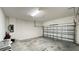 Empty two car garage with room for cars and storage at 6041 Broad Oak Dr, Davenport, FL 33837