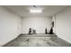 Spacious two car garage with clean epoxy flooring and plenty of room for storage at 6041 Broad Oak Dr, Davenport, FL 33837