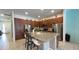Spacious kitchen featuring a large granite island, stainless steel appliances, and ample cabinet space at 6041 Broad Oak Dr, Davenport, FL 33837