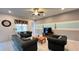 Well-lit living room with comfortable seating, decorative accents, and a cozy atmosphere for relaxation at 6041 Broad Oak Dr, Davenport, FL 33837