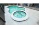 Above shot of the backyard pool and hot tub with blue tiled trim and a screened-in enclosure at 6041 Broad Oak Dr, Davenport, FL 33837