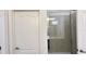 Shower with glass doors and tiled walls at 6041 Broad Oak Dr, Davenport, FL 33837