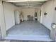 A spacious two car garage with plenty of space for storage and access to the main house at 703 Ocean Course Ave, Davenport, FL 33896