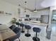 Kitchen with pendant lighting, stainless appliances, and breakfast bar seating at 703 Ocean Course Ave, Davenport, FL 33896