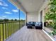 Relaxing screened patio with comfortable seating, outdoor view, and seamless indoor-outdoor flow at 703 Ocean Course Ave, Davenport, FL 33896