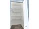 Organized walk in closet with metal racks for optimal storage in the house at 703 Ocean Course Ave, Davenport, FL 33896