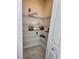 Well organized walk in closet with racks and shelves and a first aid kit at 703 Ocean Course Ave, Davenport, FL 33896