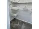 A compact walk-in closet with metal shelving and gray carpet at 703 Ocean Course Ave, Davenport, FL 33896