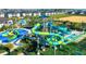 Community waterpark including a splash pad, water slides, and lounge areas at 703 Ocean Course Ave, Davenport, FL 33896