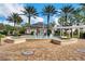 Beautiful community fountain surrounded by palm trees and lush landscaping, creating a serene ambiance at 7503 Mourning Dove Cir # 101, Reunion, FL 34747