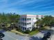 Stunning building with multiple levels, complemented by lush landscaping, and beautiful balconies at 7503 Mourning Dove Cir # 101, Reunion, FL 34747