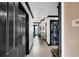 Hallway leading into the home, featuring in-unit washer/dryer and modern finishes, adding convenience and style at 7503 Mourning Dove Cir # 101, Reunion, FL 34747