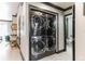 Conveniently stacked washer and dryer units, complemented by modern interior design and nearby workspace at 7503 Mourning Dove Cir # 101, Reunion, FL 34747