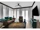 Bright living room with stylish furnishings, sheer curtains, and a modern ceiling fan at 7503 Mourning Dove Cir # 101, Reunion, FL 34747