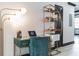 Stylish office space with modern desk, chair, shelving unit, and ample lighting for a productive work environment at 7503 Mourning Dove Cir # 101, Reunion, FL 34747