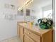 The bathroom features a large vanity, sink, a mirror, and decorative swan planter at 7807 Turkey Oak Ln, Kissimmee, FL 34747