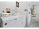 Functional laundry room with washer, dryer, and water heater at 7807 Turkey Oak Ln, Kissimmee, FL 34747