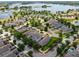 Aerial view of the property highlighting its lush landscaping within a well-maintained neighborhood at 8262 Bayview Crossing Dr, Winter Garden, FL 34787