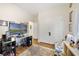 Functional bedroom with a comfortable seating area, wood floors, closet, and plenty of wall decor at 8262 Bayview Crossing Dr, Winter Garden, FL 34787