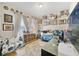 This bedroom has lots of natural light, decorative decor, wood floors and a cozy layout at 8262 Bayview Crossing Dr, Winter Garden, FL 34787