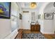Bright entryway featuring wood floors, a wood bench, and natural light from the window at 8262 Bayview Crossing Dr, Winter Garden, FL 34787