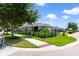Exterior view of the home highlighting its beautiful landscaping, fenced yard, and architectural details at 8262 Bayview Crossing Dr, Winter Garden, FL 34787