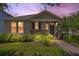 Charming single-story home with stone accents, manicured landscaping and a brick walkway leading to the front door at 8262 Bayview Crossing Dr, Winter Garden, FL 34787