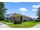Charming single-story home with stone accents, manicured landscaping and a fenced front yard at 8262 Bayview Crossing Dr, Winter Garden, FL 34787