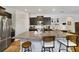 Modern kitchen boasts a large island with barstool seating and appliances at 8262 Bayview Crossing Dr, Winter Garden, FL 34787
