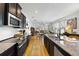 Stylish kitchen with dark cabinets and stainless steel appliances at 8262 Bayview Crossing Dr, Winter Garden, FL 34787