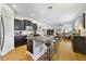 Spacious kitchen featuring a large island with seating and dark cabinetry at 8262 Bayview Crossing Dr, Winter Garden, FL 34787