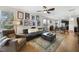 Open living space with kitchen, dining area, and living room with fan at 8262 Bayview Crossing Dr, Winter Garden, FL 34787