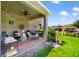 Cozy covered patio with comfortable seating, stylish decor, and serene outdoor view at 8262 Bayview Crossing Dr, Winter Garden, FL 34787