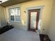 Private outdoor patio with a door, window, and a neutral color scheme at 8271 Maritime Flag St # 109, Windermere, FL 34786