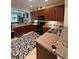 Well-equipped kitchen with ample counter space, dark wood cabinets, and modern appliances at 8271 Maritime Flag St # 109, Windermere, FL 34786