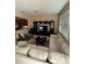 Spacious living room with large windows, comfortable seating, and a built-in entertainment center at 8271 Maritime Flag St # 109, Windermere, FL 34786