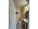 Well-lit half bathroom with a pedestal sink, tile flooring, and neutral wall color at 8271 Maritime Flag St # 109, Windermere, FL 34786