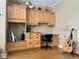 Bedroom with built-in cabinets, drawers, desk and chair accompanied by a pink music stand at 907 Pawstand Rd, Celebration, FL 34747