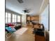 Bedroom featuring three windows, plantation shutters, a daybed, and built-in cabinets at 907 Pawstand Rd, Celebration, FL 34747