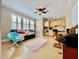 The bedroom includes plantation shutters, ceiling fan and built-in desk area at 907 Pawstand Rd, Celebration, FL 34747